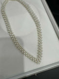 V-neck crocheted necklace that exudes elegance. Natural freshwater AK pearl necklace.